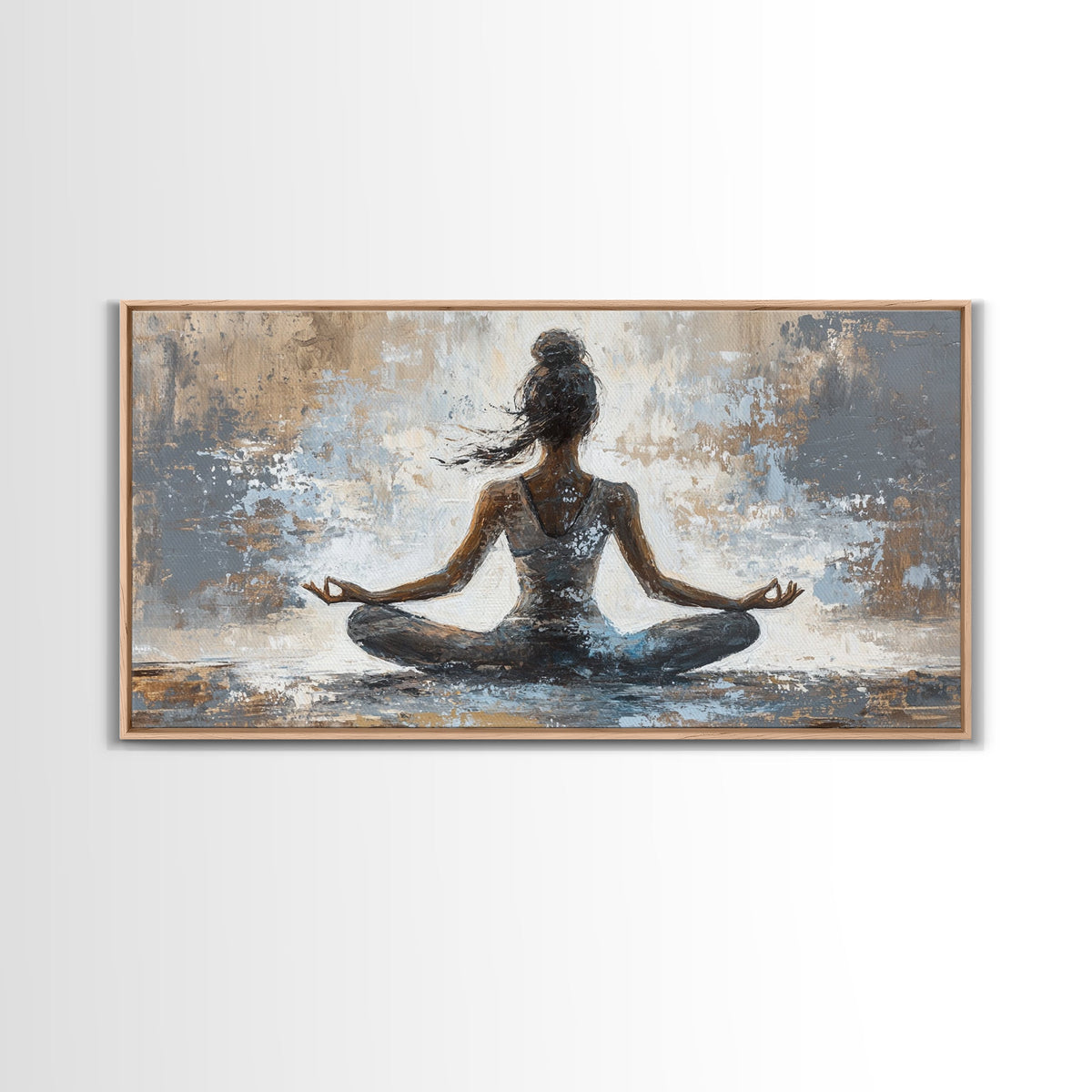Framed artwork of a woman in a meditative pose on a textured background