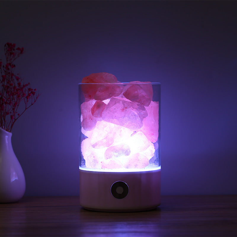 Photo of a salt lamp with purple glow.