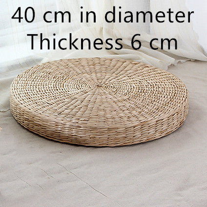 Woven round cushion with measurements on a light background