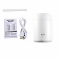 A white cylindrical humidifier container shown with a USB charging cable, a replacement filter stick, and an instruction booklet on a plain white background.