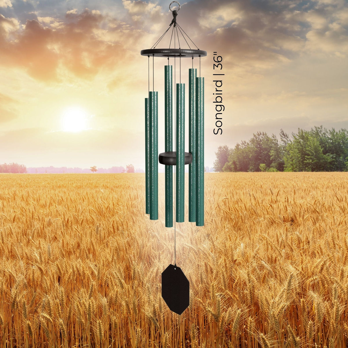 Wind chime with 'Songbird 36' label in a field of wheat during sunset.