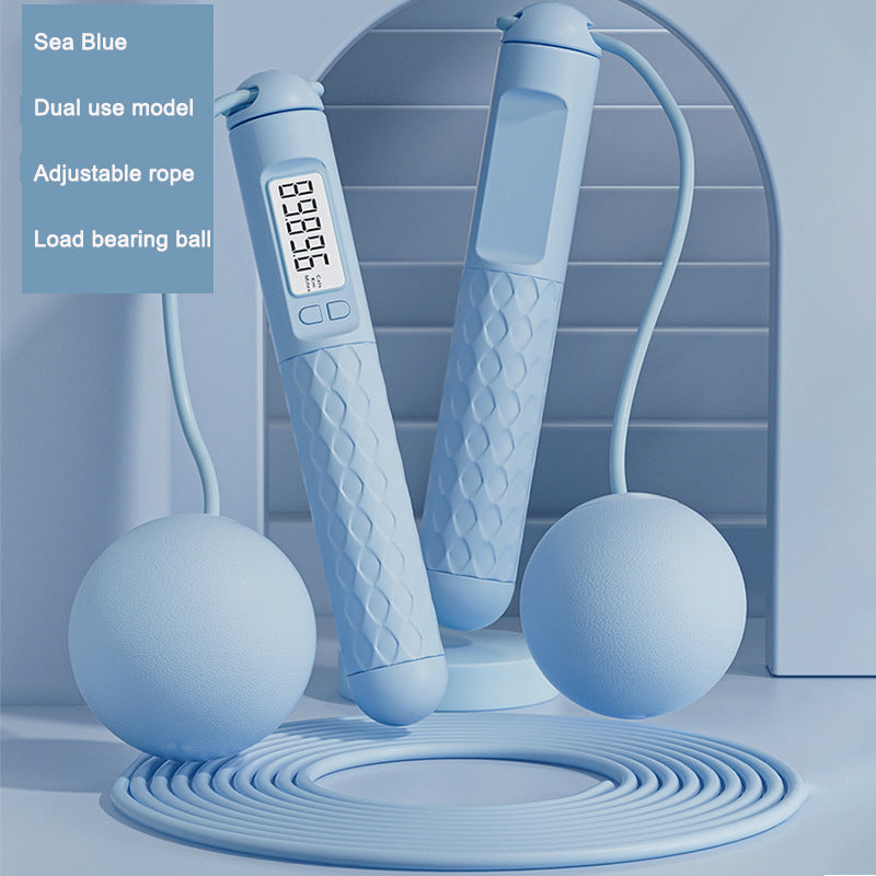 Blue jump rope with digital display and two balls on a light blue background