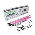 Pink and black portable Pilates reformer rod set with its white and black retail packaging box, displayed on a clean white background.