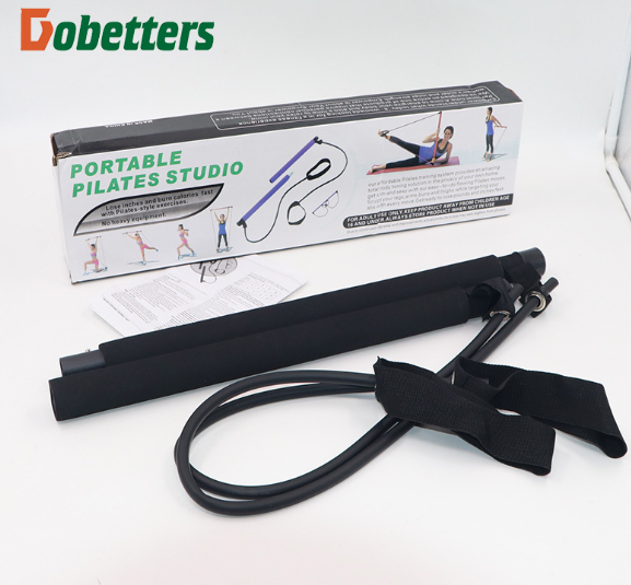 A Dobetter portable Pilates studio resistance band set with a black foam tube, black resistance loop, and black handle strap, shown in front of its white and black retail box on a white background.