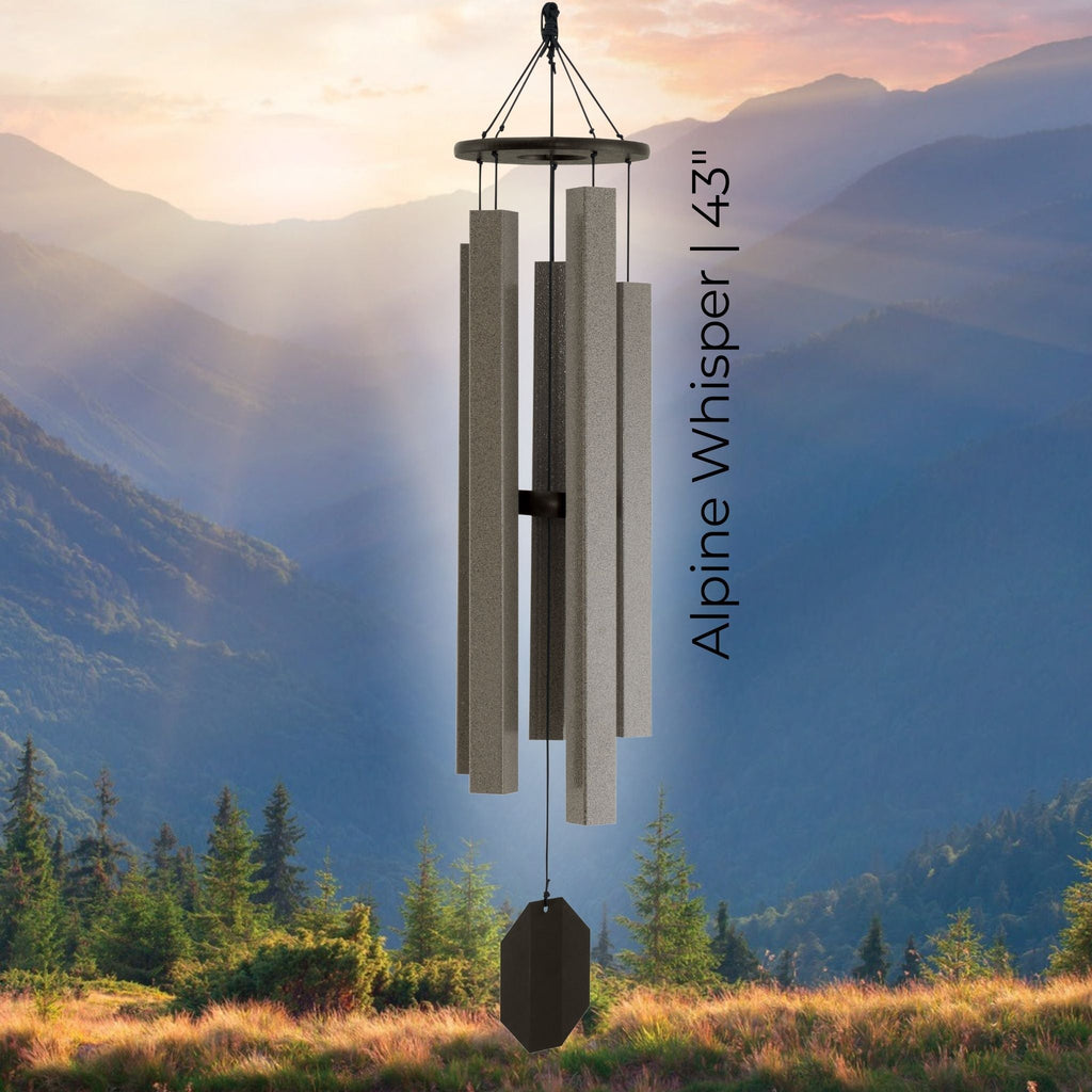 Wind chime with 'Alpine Whisper 43' text against a mountainous landscape