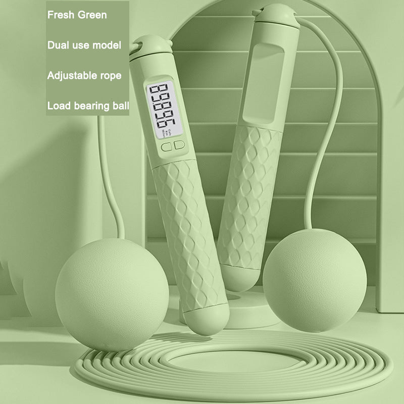 Green jump rope with digital display on a green background