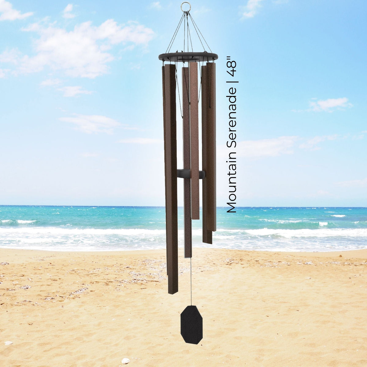 Wind chime on a beach with ocean view