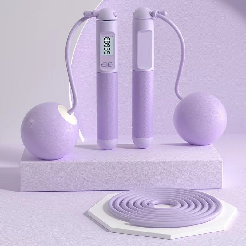 Purple jump rope with digital display on a white background