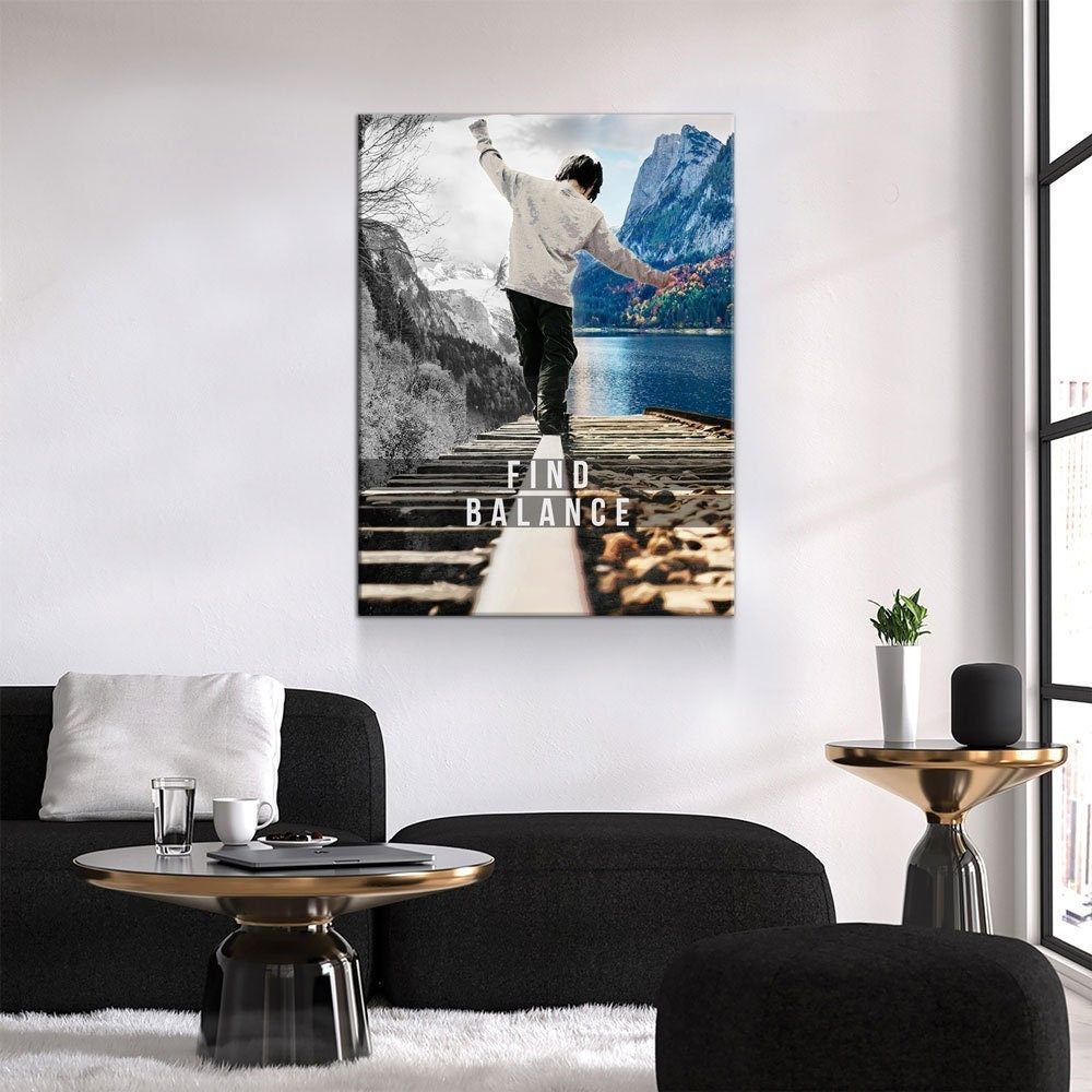 Living room with a motivational poster on the wall featuring a person by a lake with mountains.