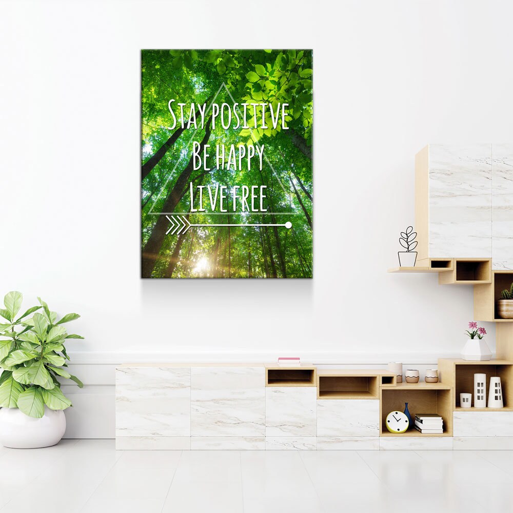 Motivational poster with nature design and text in a modern interior setting.