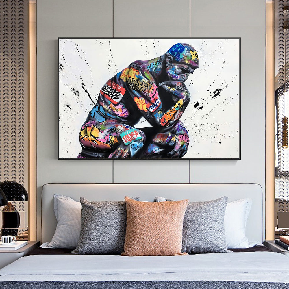 Colorful abstract painting of a gorilla on a wall above a bed with patterned headboard.