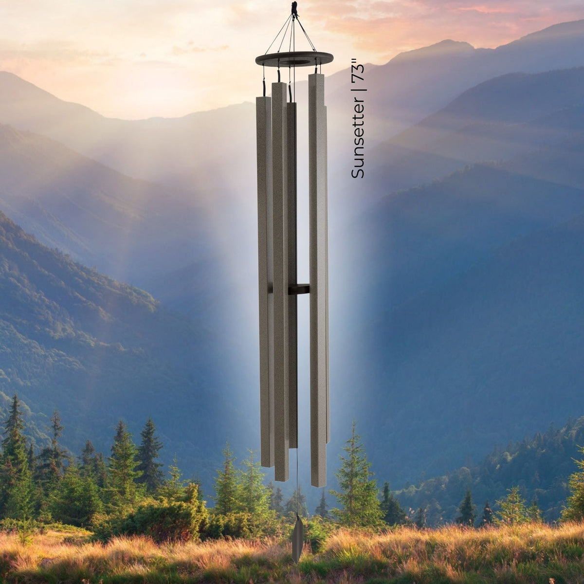 Wind chime with 'Sunsetter' label against a mountainous landscape