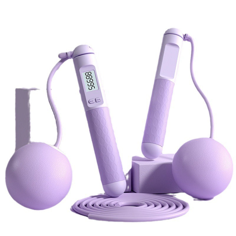 Purple jump rope set with digital counter on a white background