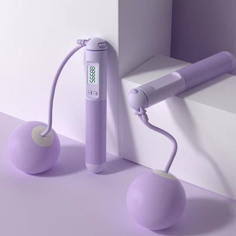 Purple handheld device with digital display on a white surface