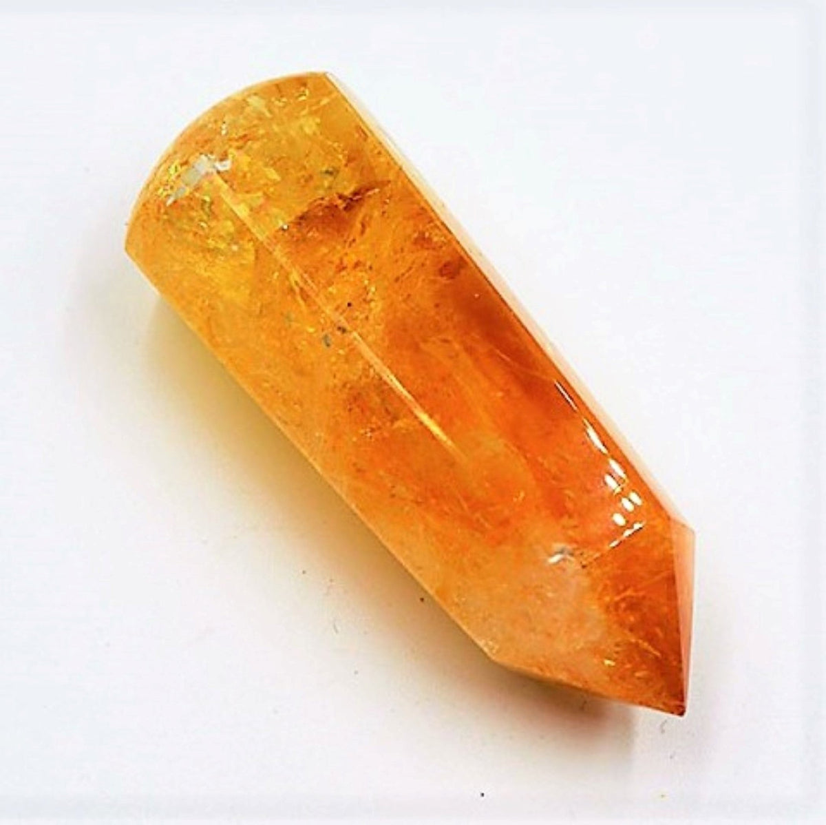 A Citrine Crystal Obelisk Gem amber and orange lighting