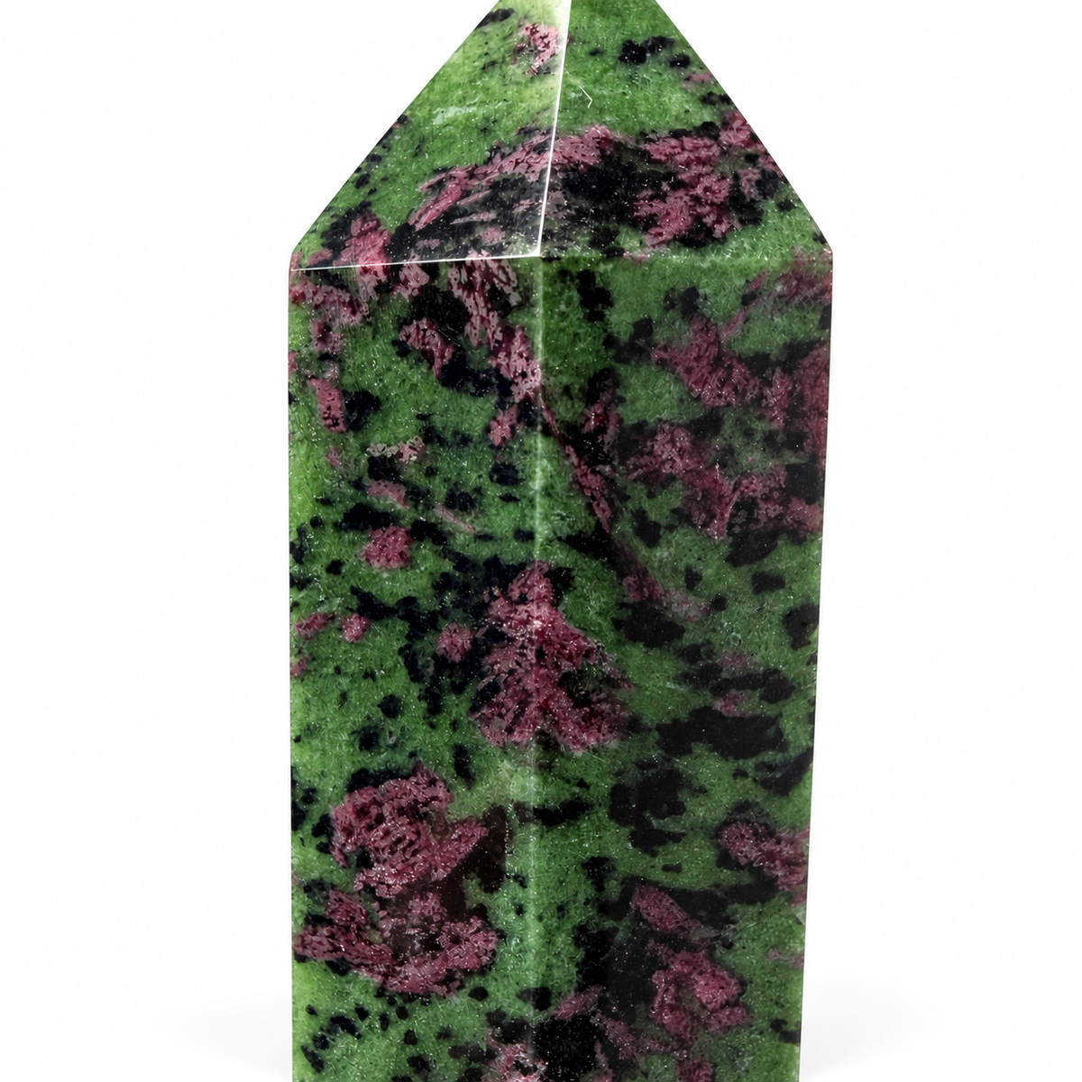 A polished green crystal point with prominent pink and black mottled patterns, shown on a clean white background.