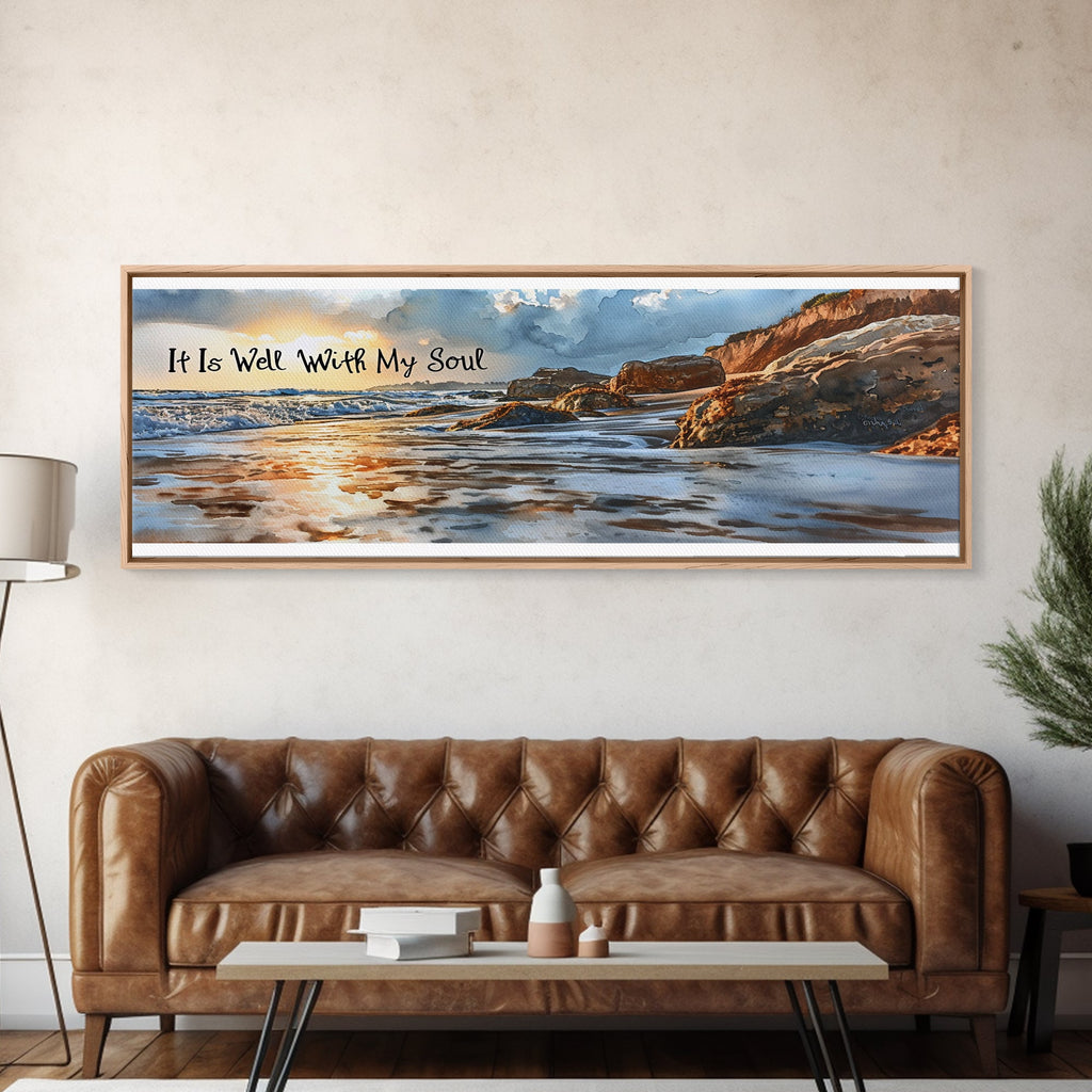 Framed artwork of a coastal scene with a brown leather sofa below.