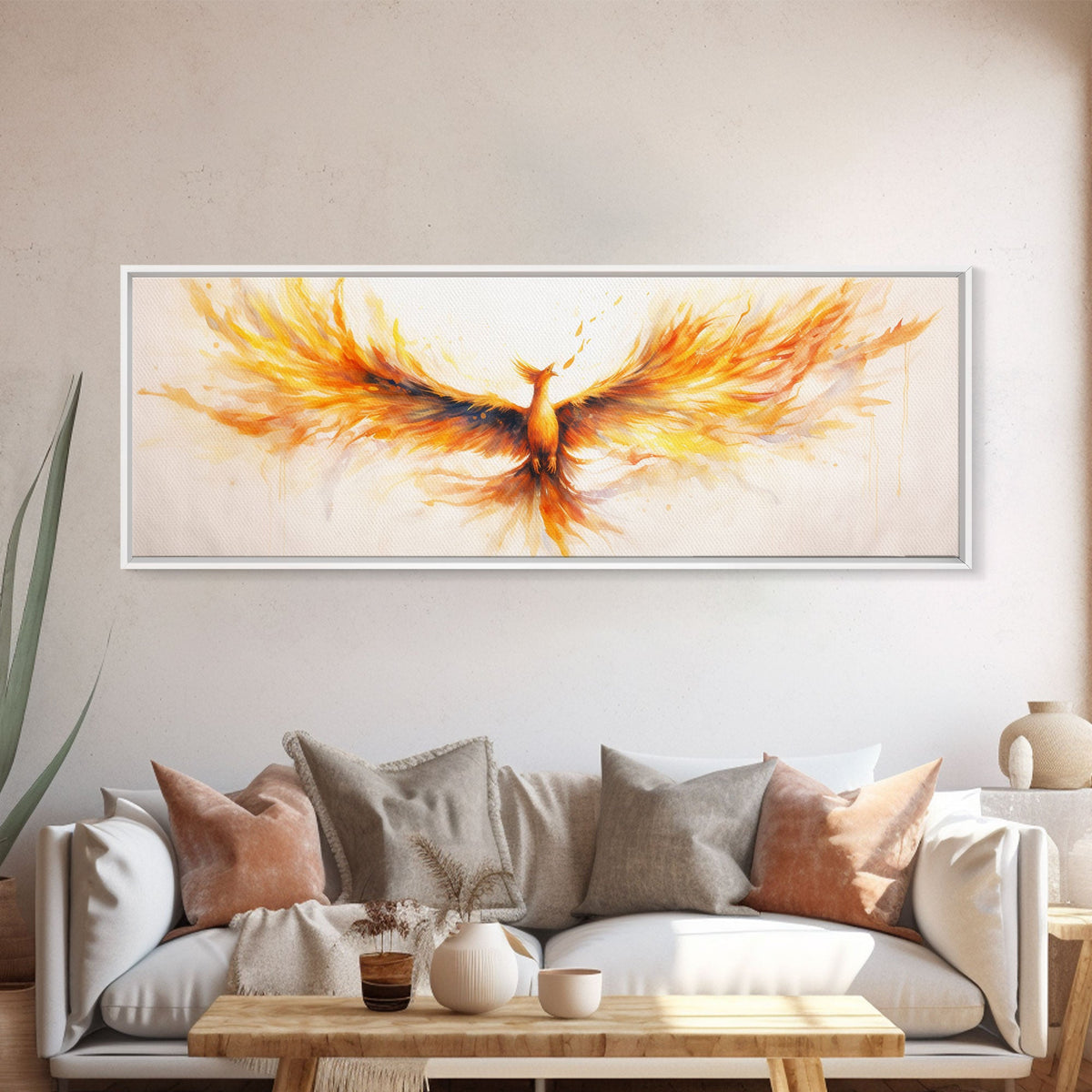 Framed abstract painting of a phoenix on a wall above a sofa with decorative pillows.