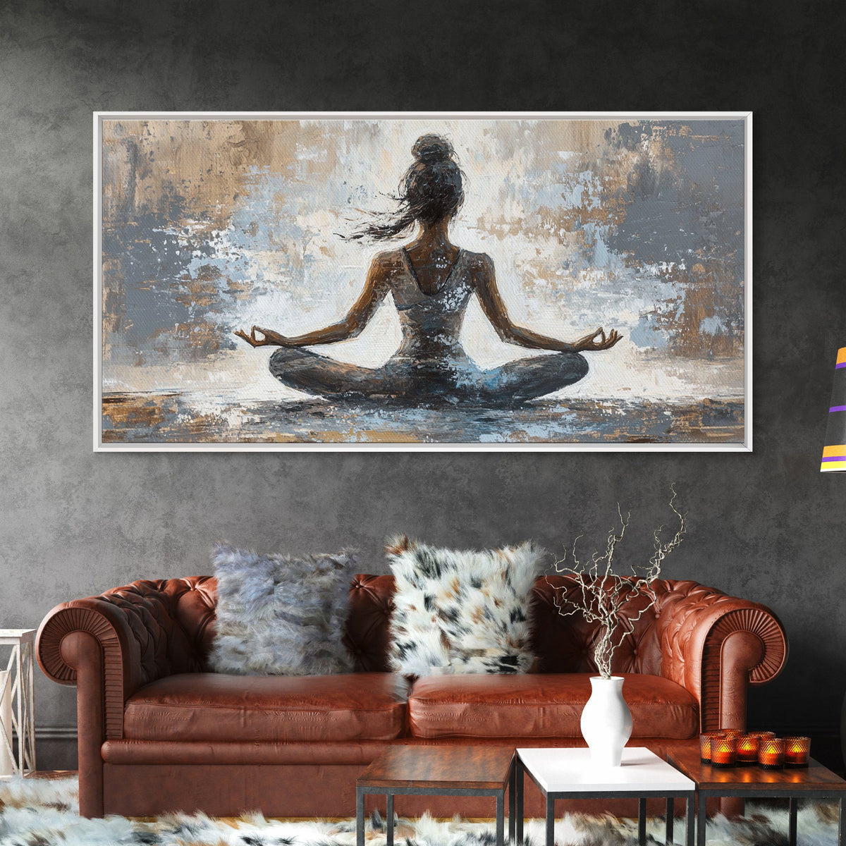 Living room with a brown sofa, decorative pillows, and a large abstract painting of a meditating figure on the wall.