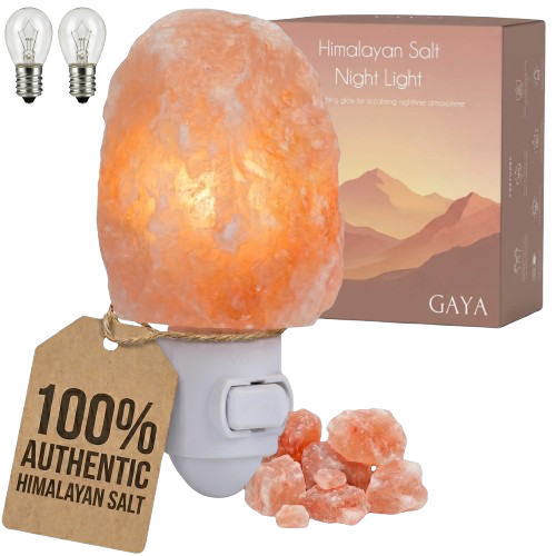 Salt lamp night light in front of a box with salt crystals in front of the night light.