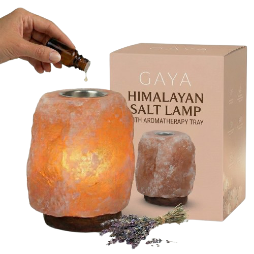 Gaya Himalayan Salt Lamp with Aromatherapy Tray and packaging, showing a hand adding essential oil.