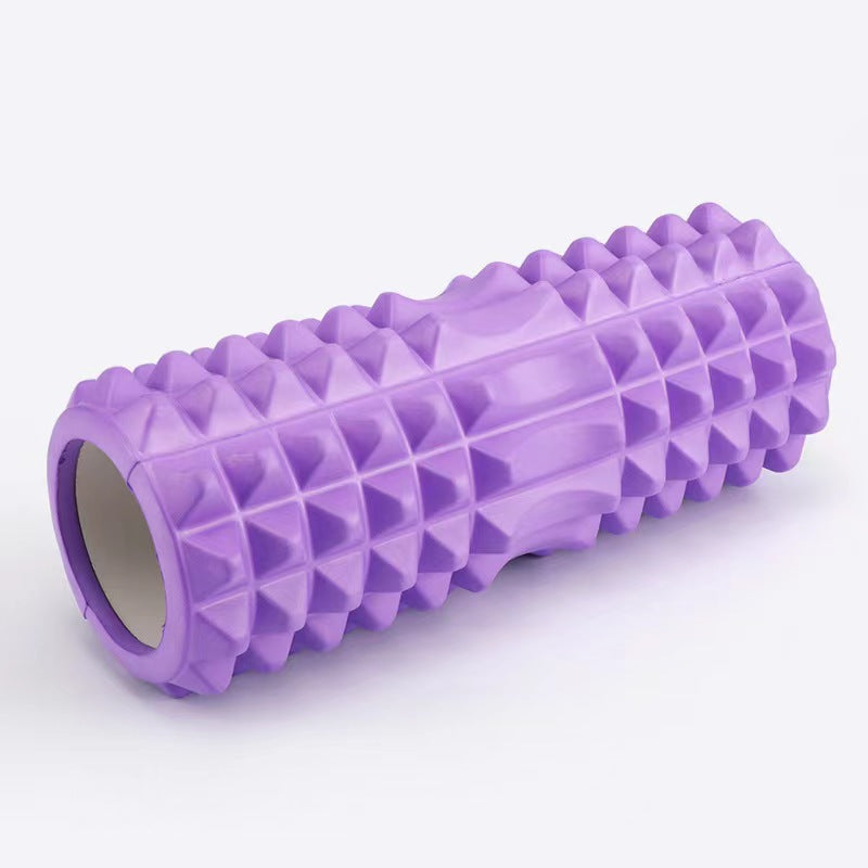 Purple foam roller with textured surface on a white background