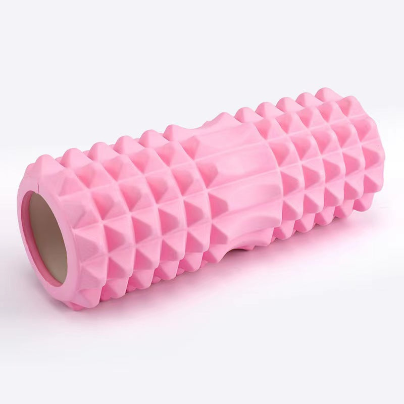 Pink foam roller on a white background