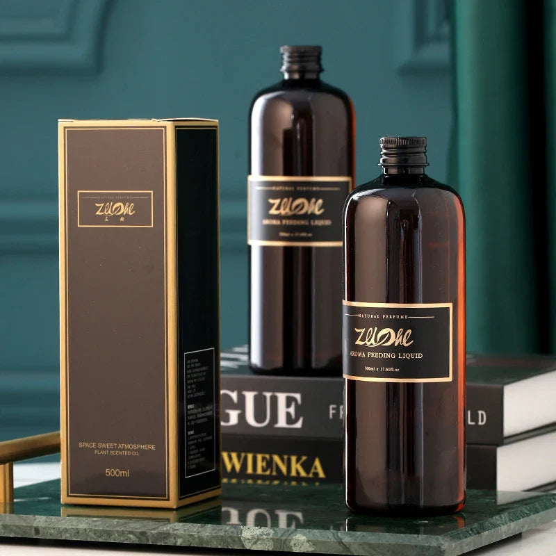 Two bottles and a box of Zulme brand on a green surface with a blurred background