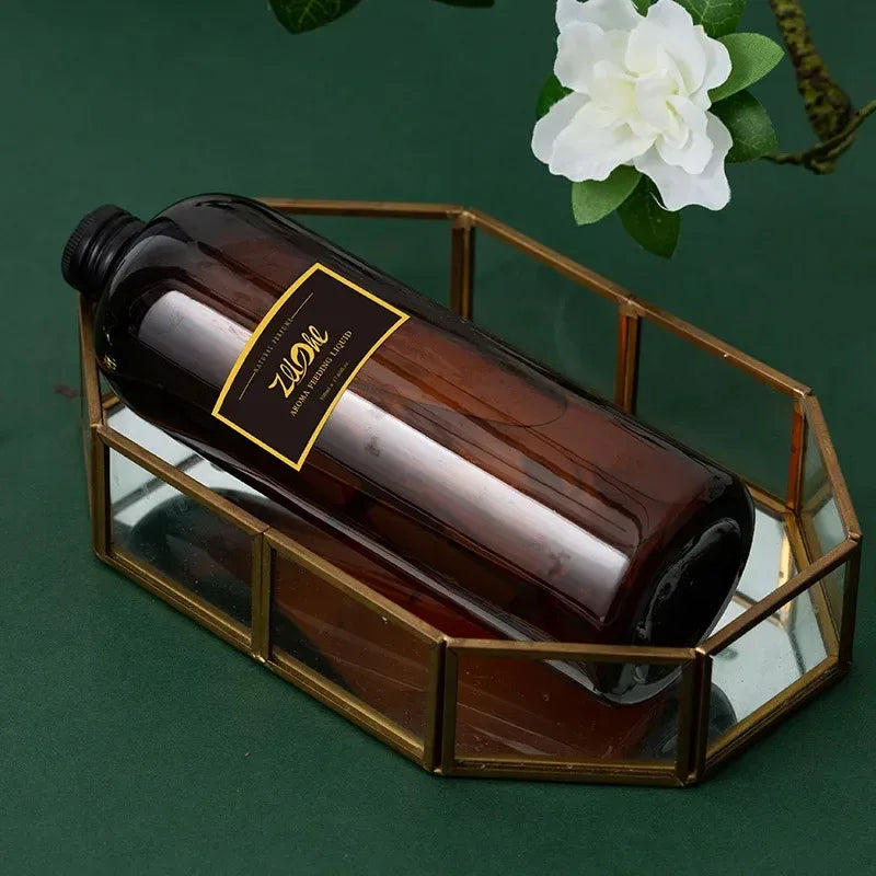 Brown bottle with a gold label in a decorative metal and glass holder on a green background