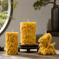 Three beeswax candles in dragon motif.