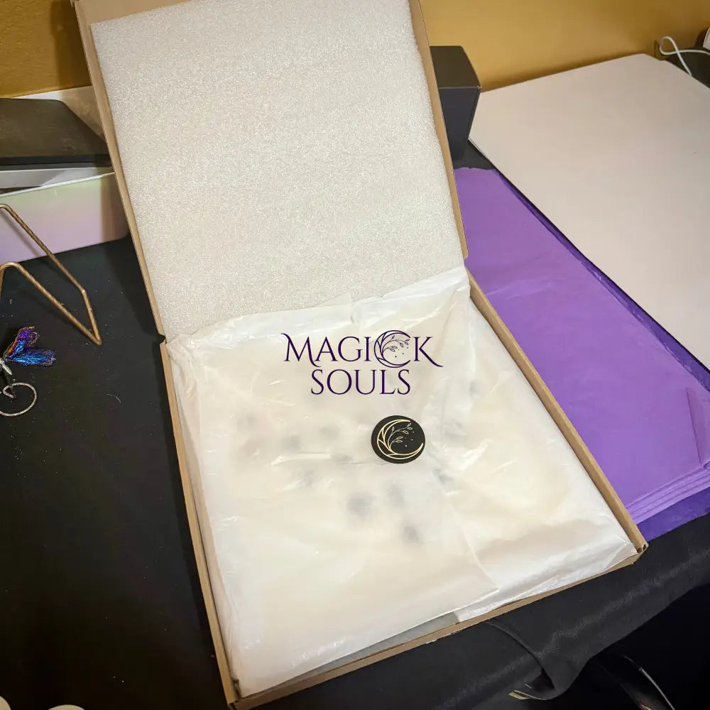 Product packaging with 'Magick Souls' branding on a table.
