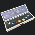 Set of model planets in a box with 'The Nine Planets' display