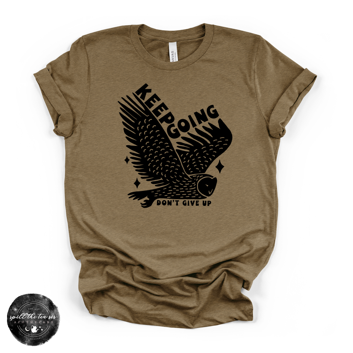 A heathered olive-brown short-sleeve t-shirt with a black graphic of an eagle and the text 'KEEPING DON'T GIVE UP' printed on the front, displayed flat against a white background.