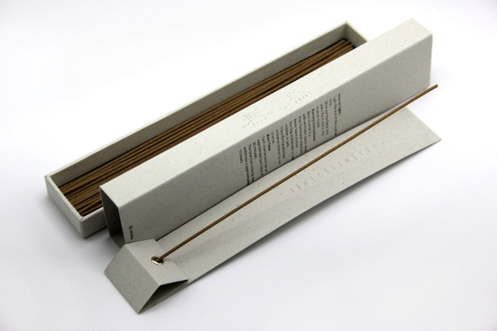 An open box of Awaken incense sticks showing the back of the box.