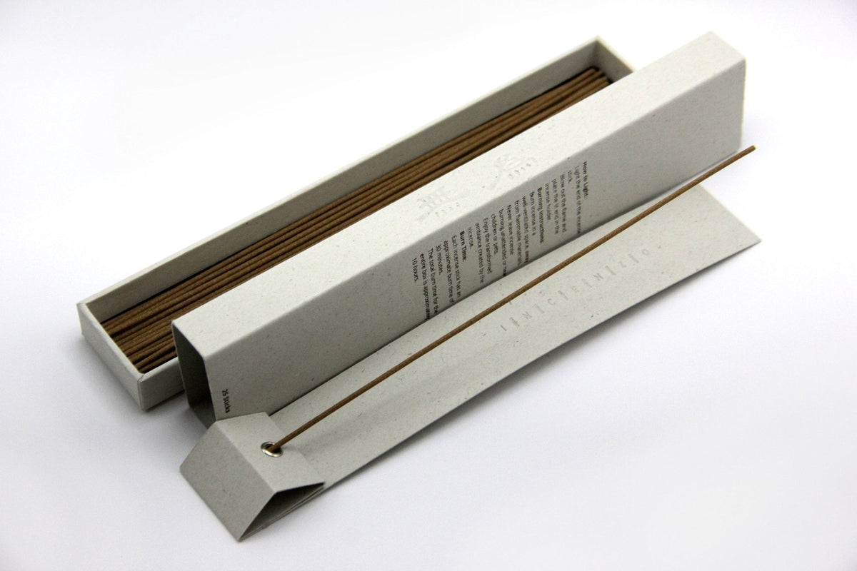 An open box of Awaken incense sticks showing the back of the box.