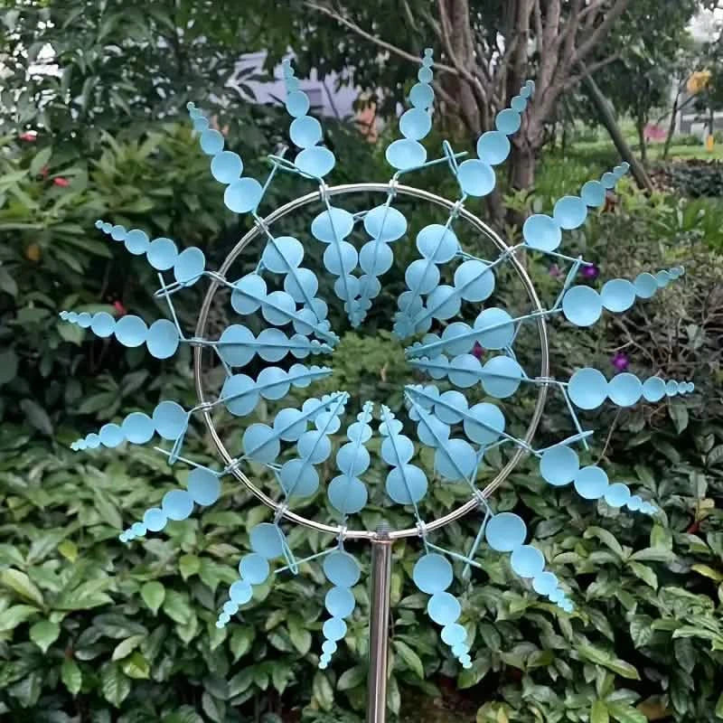 A light blue kinetic wind sculpture-spinner.