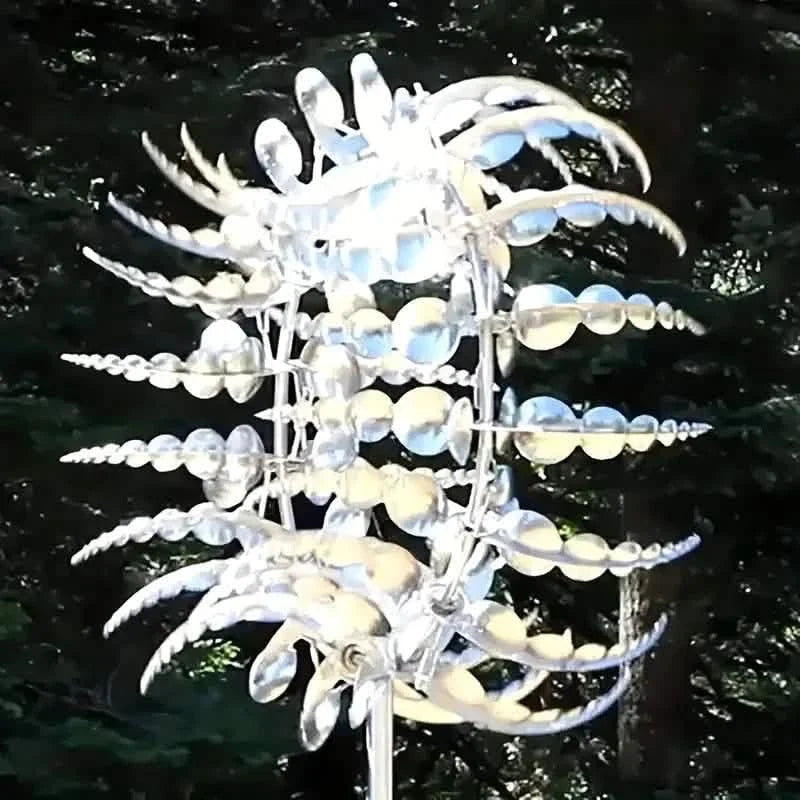 A clear and light blue kinetic wind sculpture-spinner.