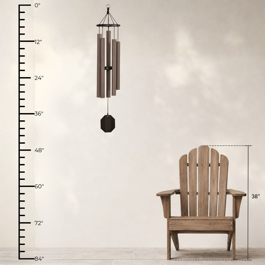 Wind chime and Adirondack chair with measurement scale on a light background