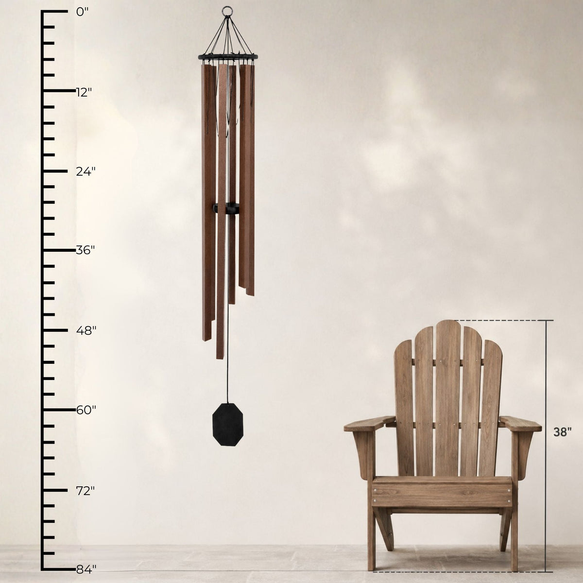 Wooden Adirondack chair and wind chime with measurement scale on a neutral background