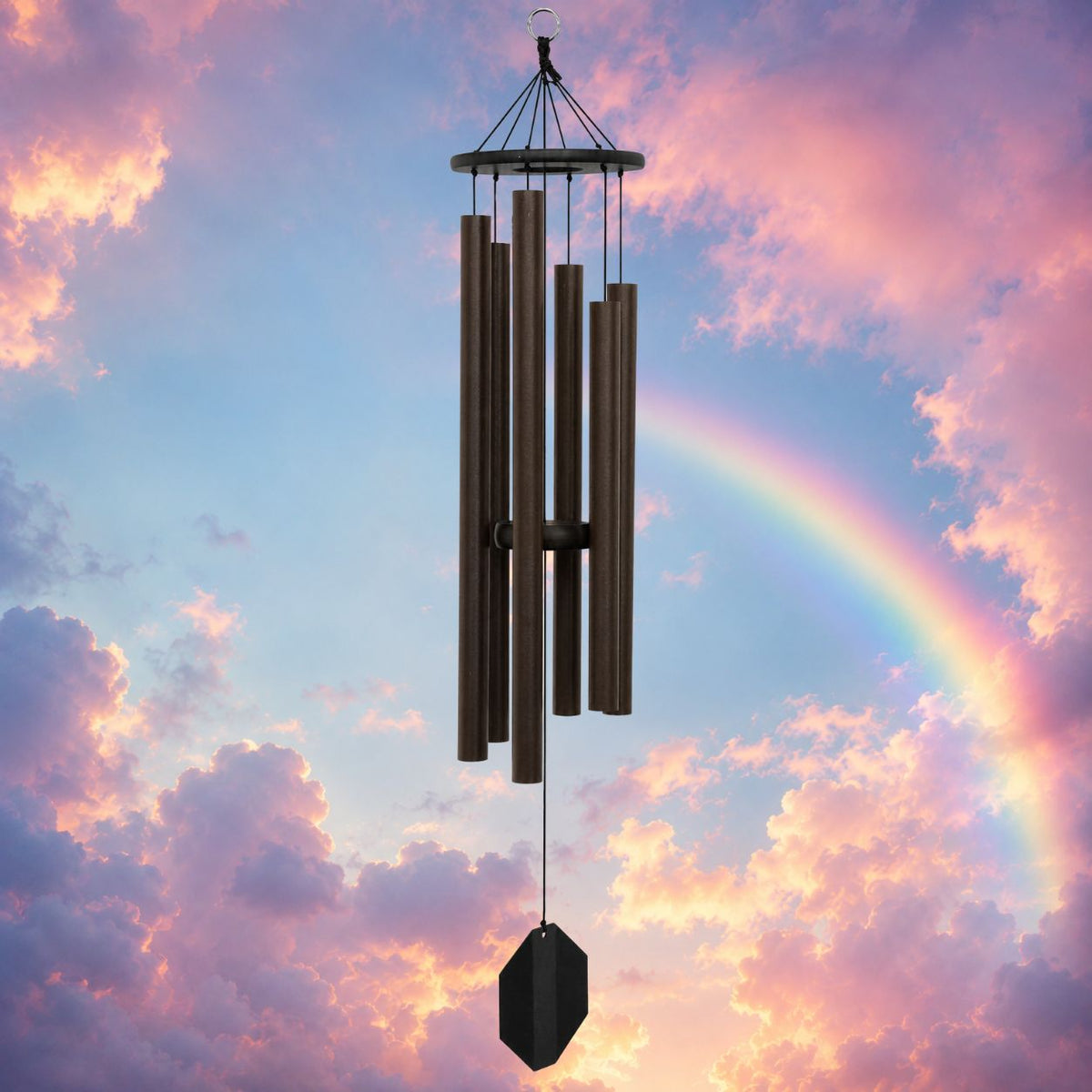 Wind chime against a colorful sky with a rainbow
