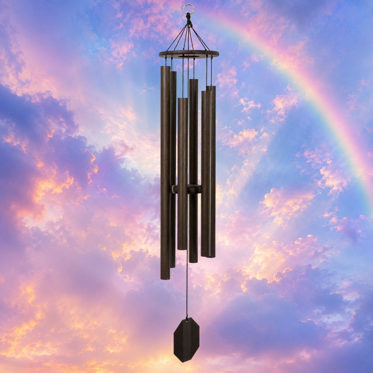 Wind chime against a colorful sky with a rainbow