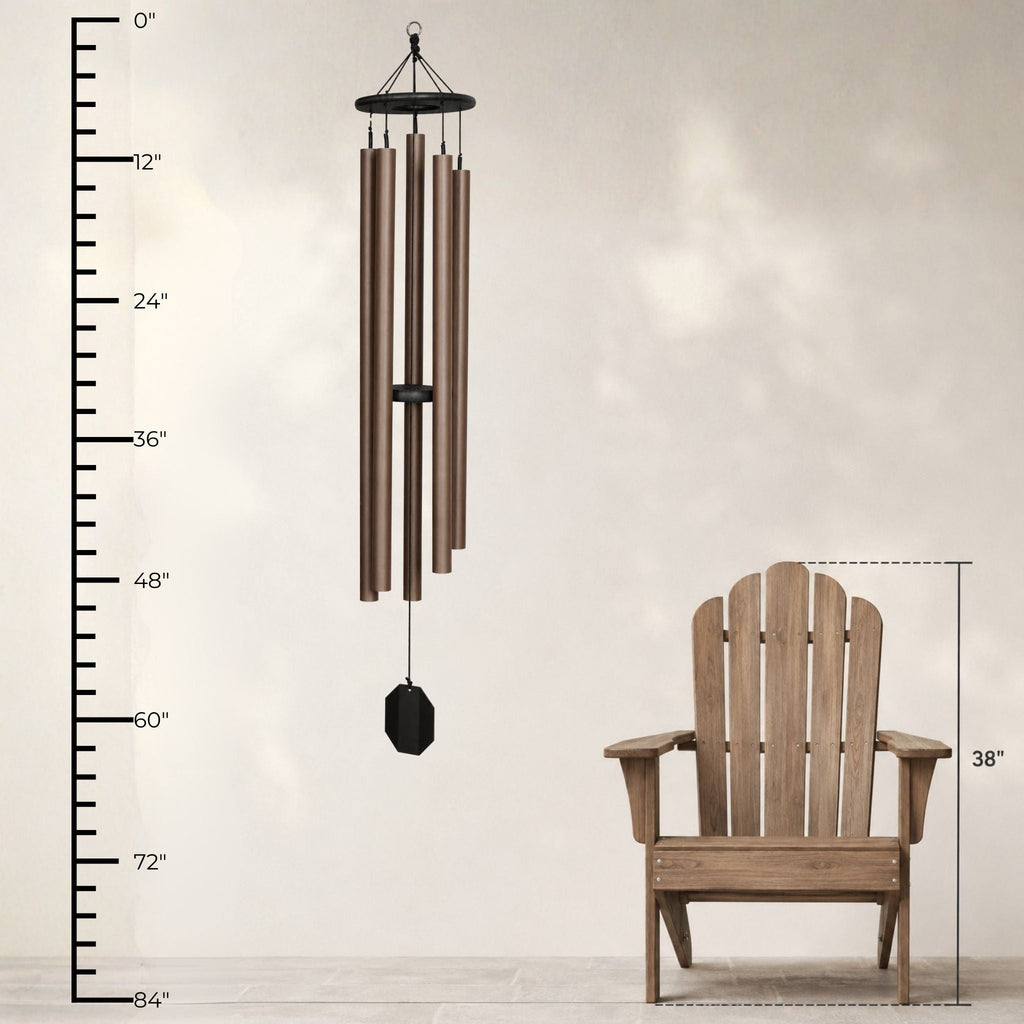 Wooden Adirondack chair and wind chime with measurement scale on a plain background