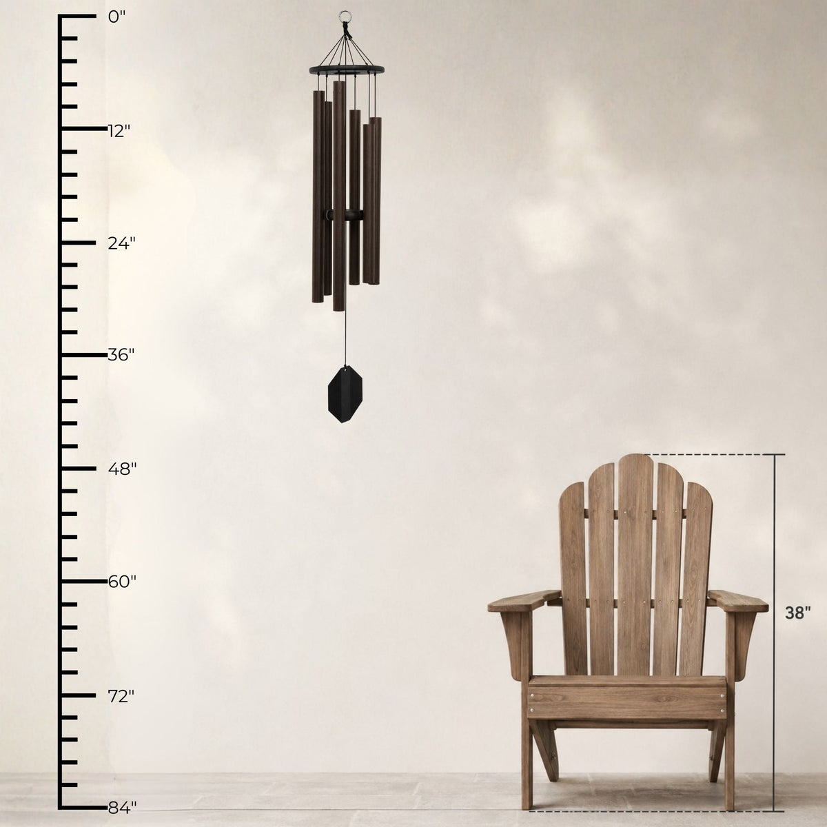 Wooden Adirondack chair with wind chime and measurement chart on a light background