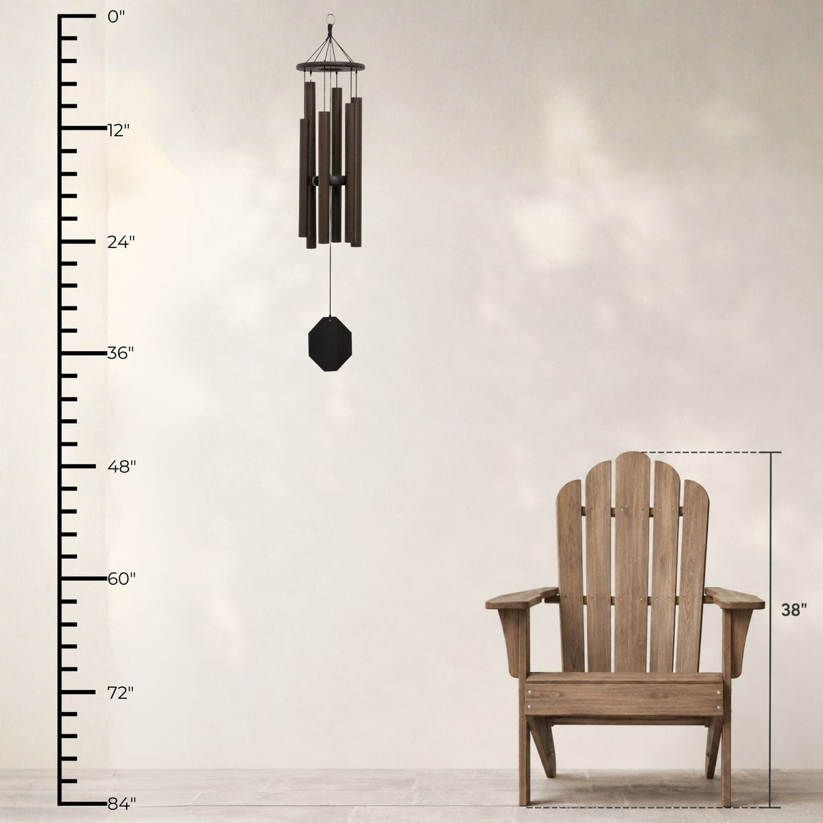 Wooden Adirondack chair with a wind chime and measurement chart on a light background