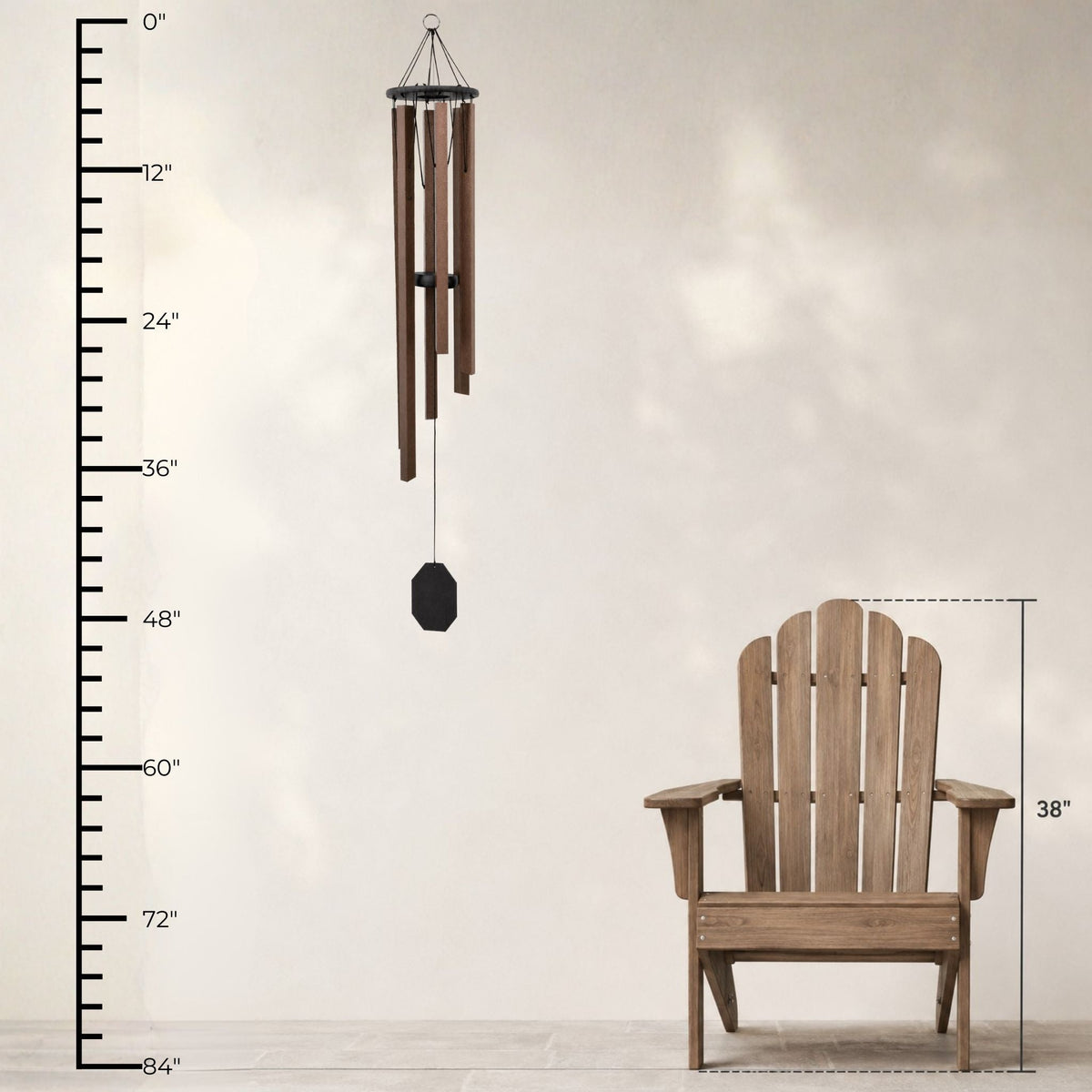 Wooden Adirondack chair with a wind chime and measurement chart on a light background