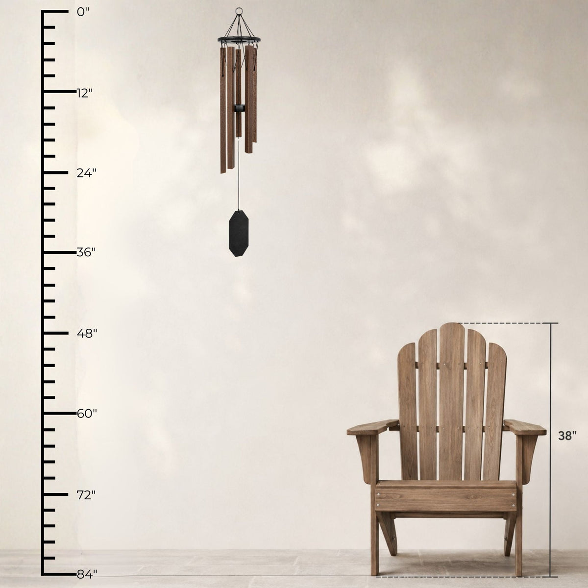Wooden Adirondack chair with a wind chime and measurement chart on a light background