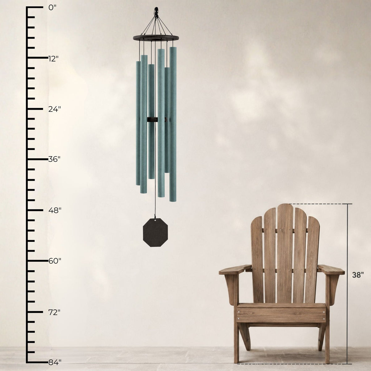 Wind chime with dimensions shown next to a wooden chair on a neutral background