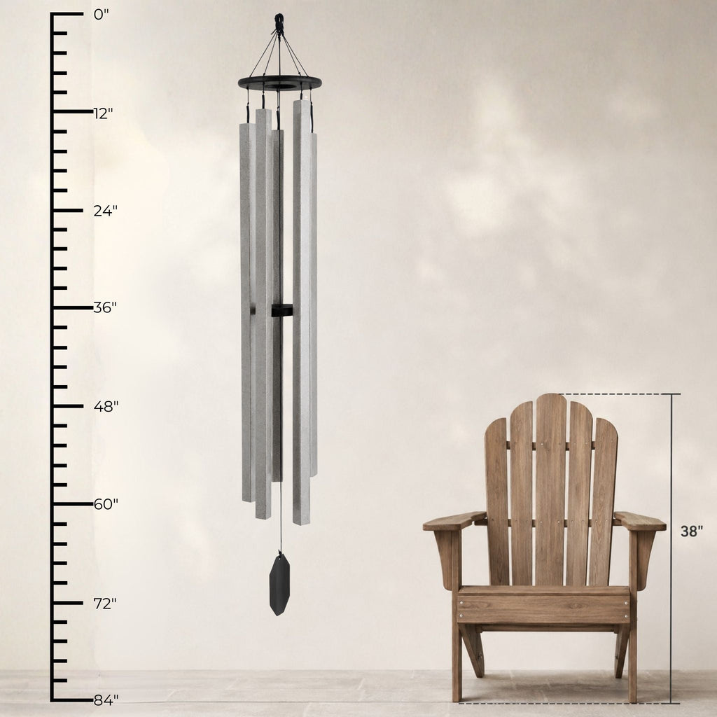 Wind chime next to a wooden chair with measurement indicators on a plain background