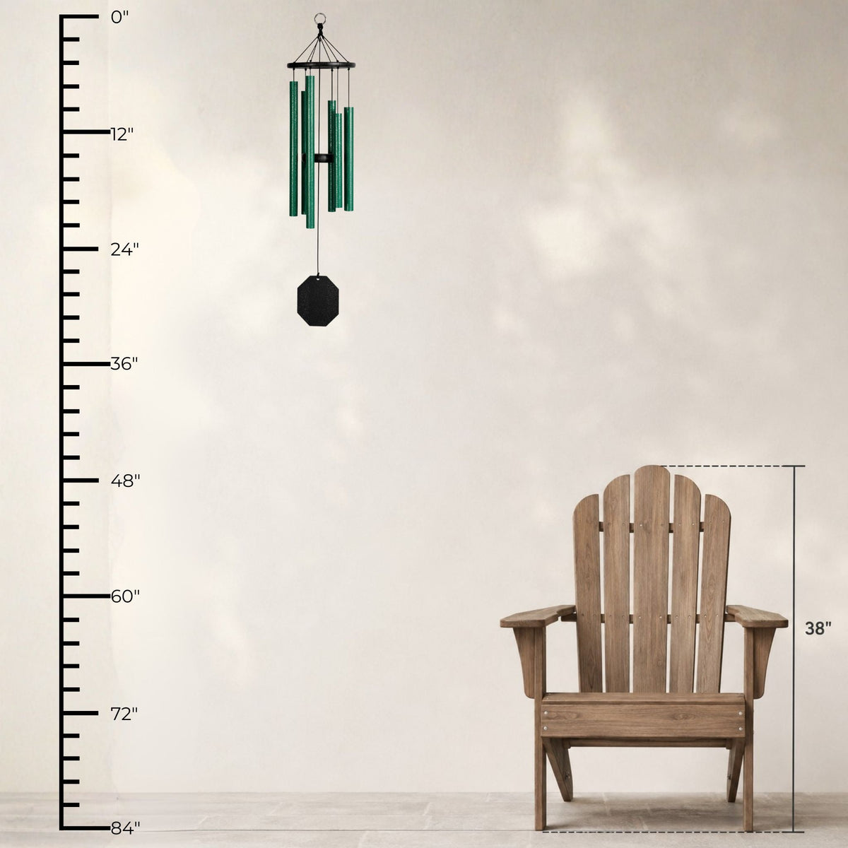 Wooden Adirondack chair with a wind chime and measurement chart on a light background