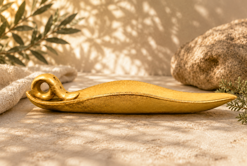 Side view of an Incense burner shaped like a leaf.